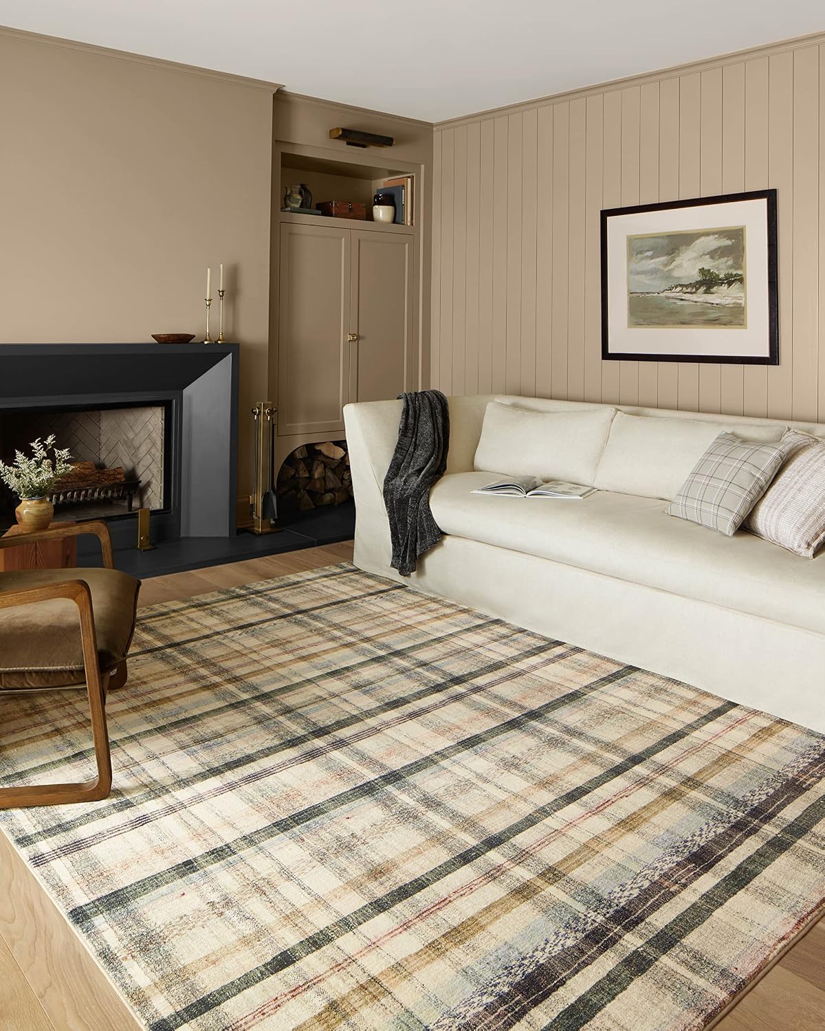 Ivory and muted multicolor checked rug shown in a living room