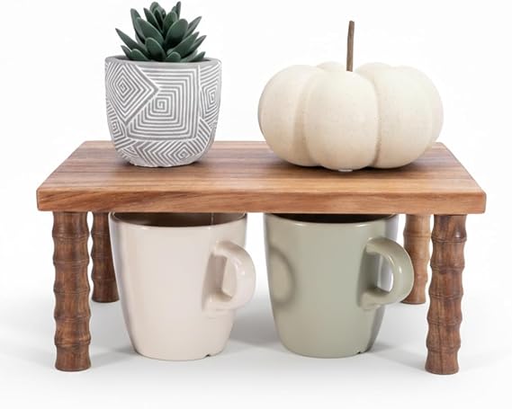 An acacia countertop riser creating two storage levels